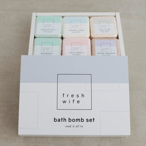 Box of bath bombs with 'fresh wife' branding on a neutral background